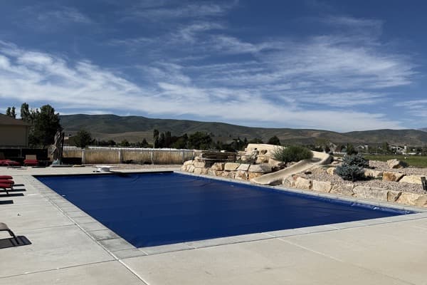 Blue pool cover with mountain view